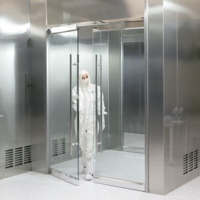 Frameless all-glass cleanroom doors minimize crevices where particles and germs can collect; suitable for labs or cleanrooms with strict cleaning protocols  |  6712-02 displayed